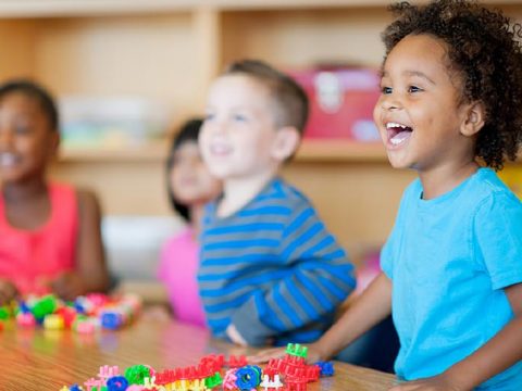 A diverse group of preschoolers in a classroom