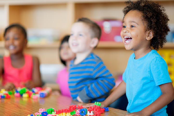 Happy children playin gin the classroom